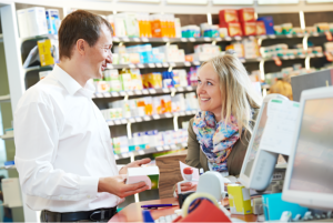 pharmacist assisting his clients